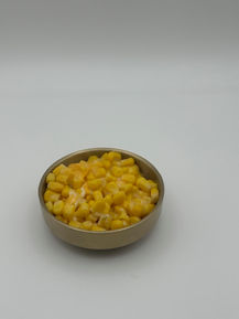 Corn with melted cheese in a bowl
